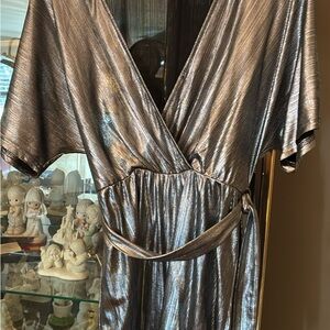 Black and sliver Romper with wrap around belt. Super cute! Size small